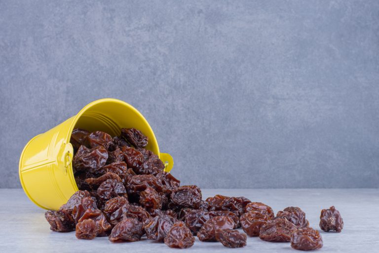 Dried sour cherries isolated in a plate on the background